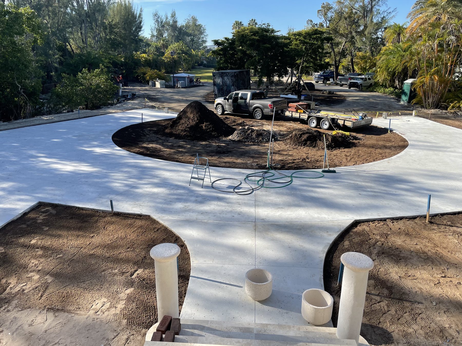Finished circular estate driveway with center island and entry columns