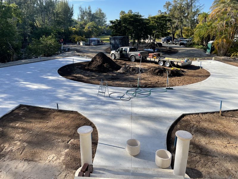 Finished circular estate driveway with center island and entry columns